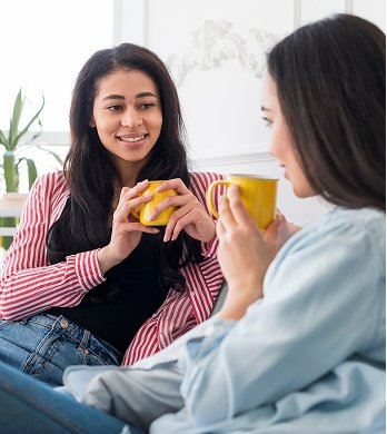 beautiful-girlfriends-talking-having-hot-drink